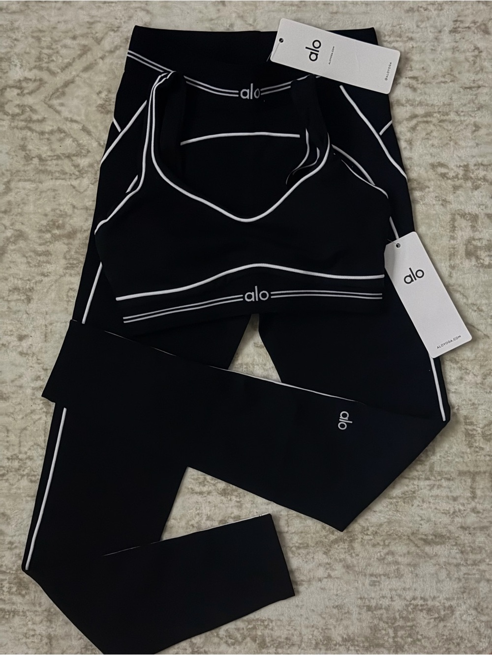 ALO Yoga Black Seamless Strappy Sports Bra and Leggings Set with White Trim